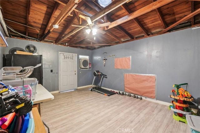 interior space featuring wooden ceiling, refrigerator, wood finished floors, and baseboards