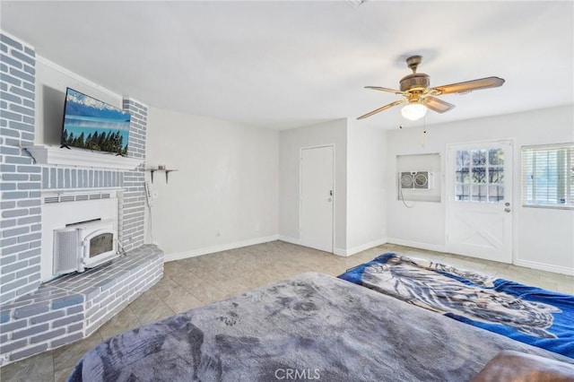 interior space with tile patterned floors, baseboards, and ceiling fan