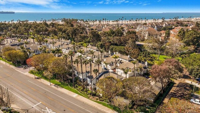 birds eye view of property with a view of the beach, a water view, and a residential view