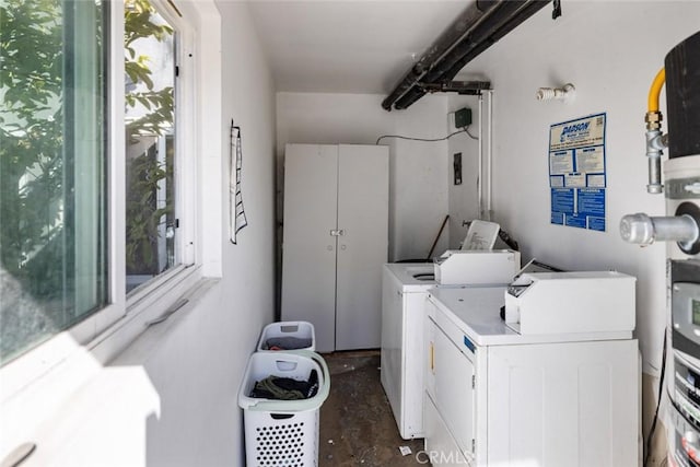 common laundry area featuring washer and dryer and a healthy amount of sunlight