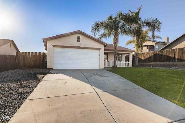 ranch-style home featuring a front lawn, fence, concrete driveway, stucco siding, and a garage