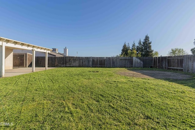 view of yard featuring a patio and a fenced backyard