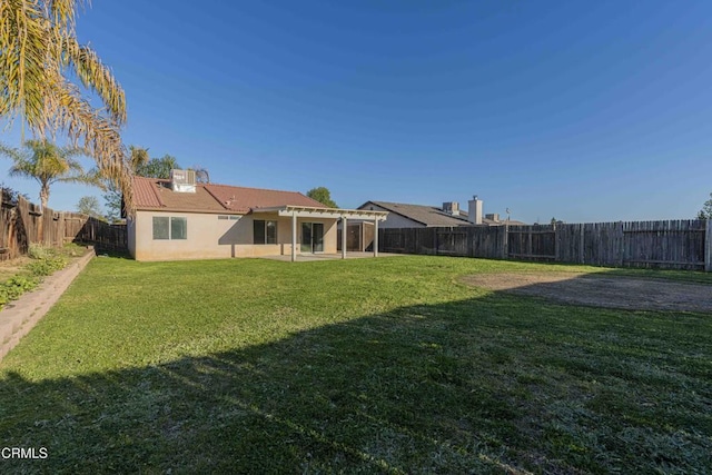 view of yard with a patio area and a fenced backyard