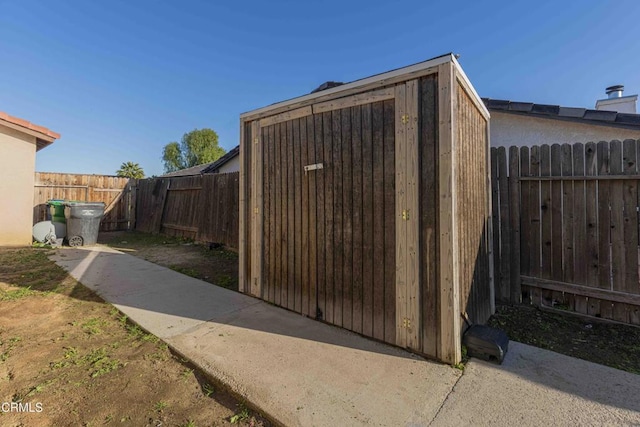 view of shed featuring a fenced backyard