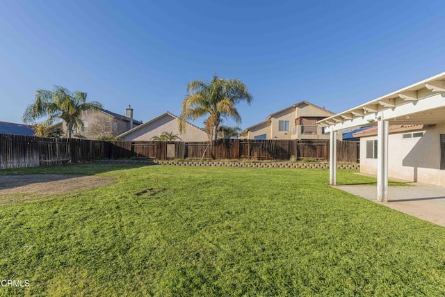 view of yard with a patio area and a fenced backyard