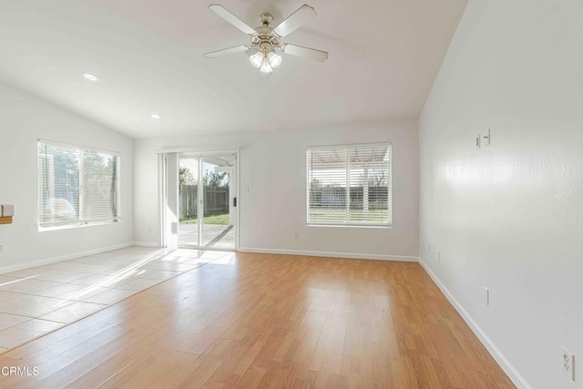 empty room with baseboards, light wood finished floors, lofted ceiling, recessed lighting, and ceiling fan