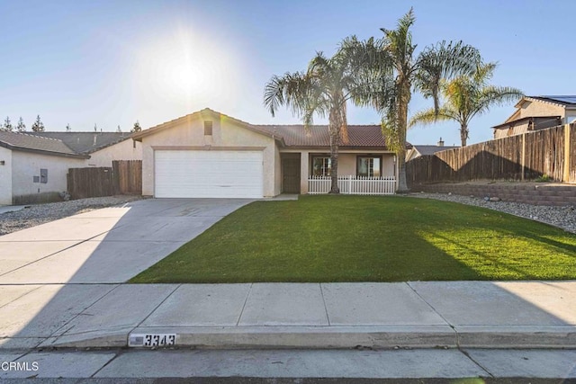 ranch-style home featuring stucco siding, driveway, a front lawn, fence, and a garage