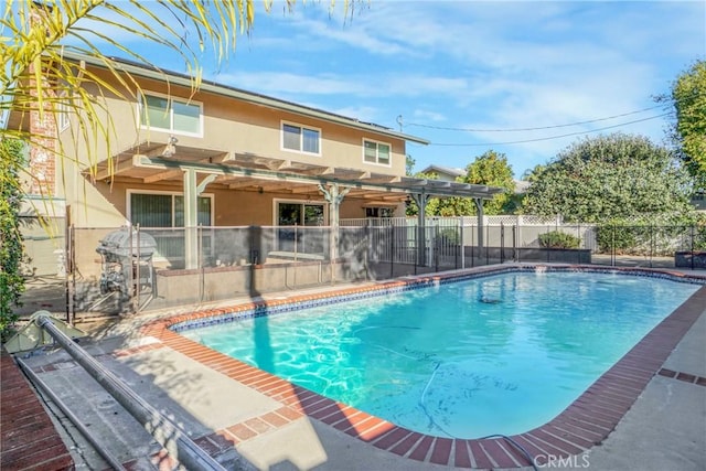 view of swimming pool featuring a fenced in pool, a patio area, grilling area, and fence