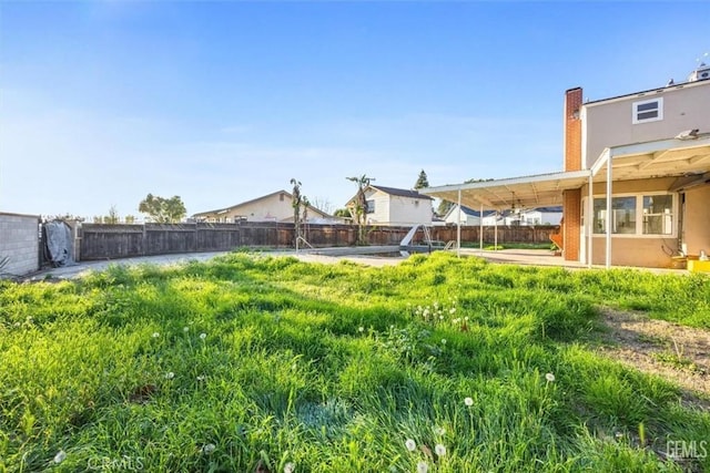 view of yard with a fenced backyard