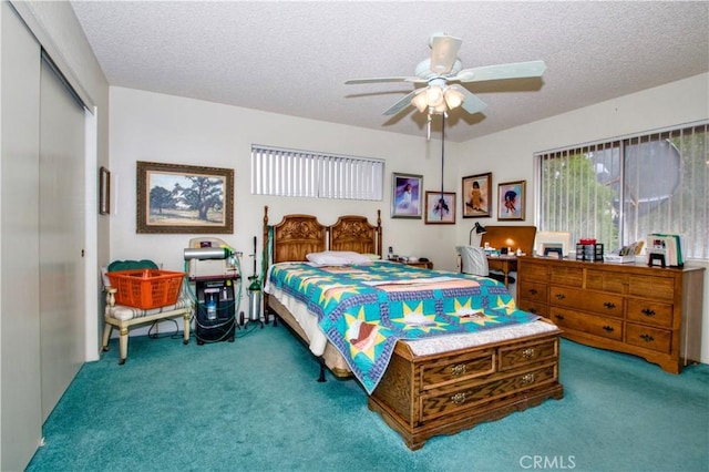 61615 El Cajon Dr, Joshua Tree, CA 92252 - bedroom featuring a closet, a textured ceiling, a ceiling fan, and carpet floors
