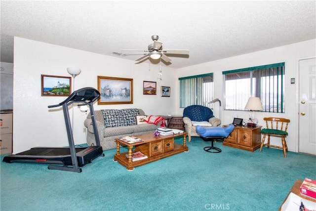 61615 El Cajon Dr, Joshua Tree, CA 92252 - living area with visible vents, ceiling fan, carpet, and a textured ceiling