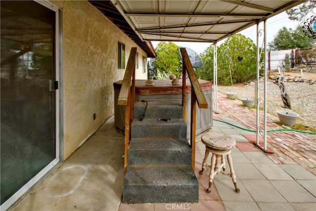 view of patio with a hot tub