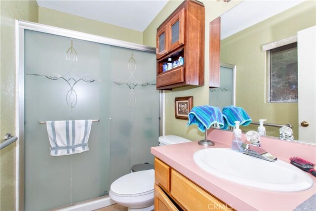 61615 El Cajon Dr, Joshua Tree, CA 92252 - bathroom with a shower stall, vanity, and toilet