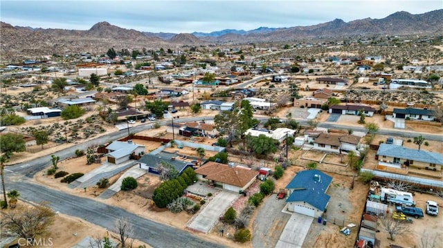 bird's eye view with a residential view and a mountain view