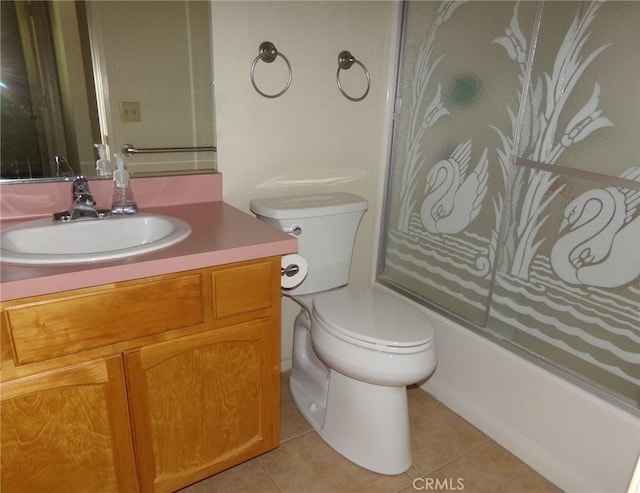 61615 El Cajon Dr, Joshua Tree, CA 92252 - bathroom with tile patterned floors, vanity, toilet, and bath / shower combo with glass door