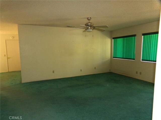 61615 El Cajon Dr, Joshua Tree, CA 92252 - carpeted empty room with a textured ceiling, ceiling fan, and visible vents