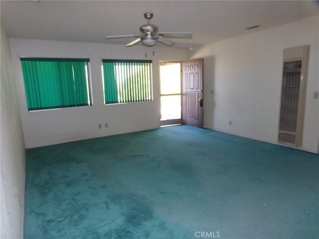 61615 El Cajon Dr, Joshua Tree, CA 92252 - carpeted spare room with a heating unit and a ceiling fan