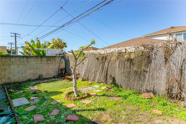 view of yard with a fenced backyard