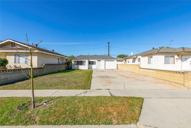 ranch-style house with concrete driveway, a front lawn, and fence