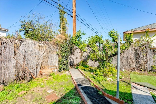 view of yard with a fenced backyard