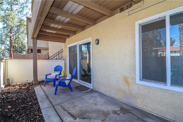 view of patio with fence