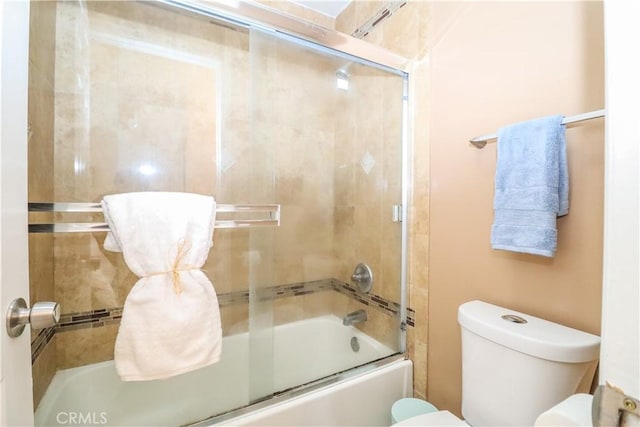 full bathroom featuring toilet and enclosed tub / shower combo