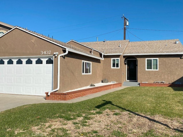 back of house featuring stucco siding, a lawn, driveway, roof with shingles, and an attached garage