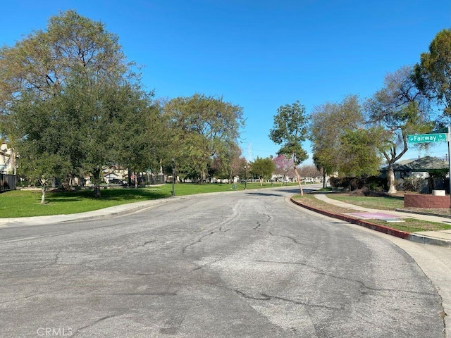 view of road featuring sidewalks and curbs