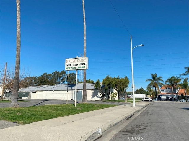 view of street with street lights and sidewalks