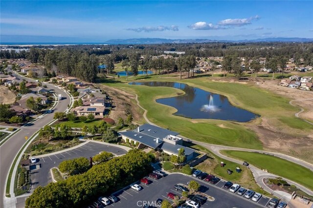 bird's eye view with a water view and golf course view