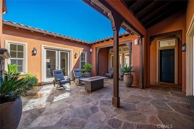 view of patio featuring an outdoor fire pit