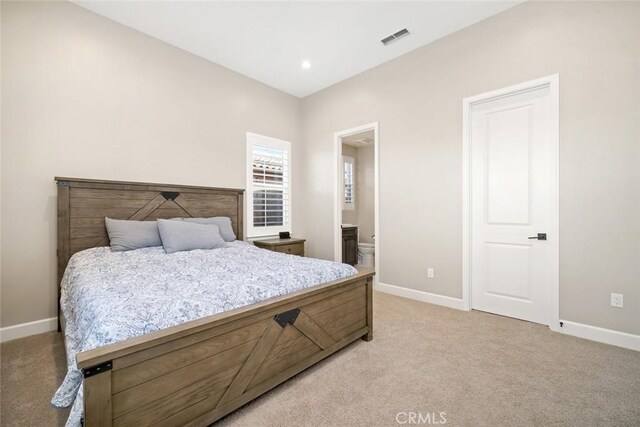 bedroom with light colored carpet, recessed lighting, baseboards, and visible vents