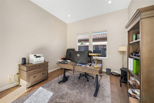 home office featuring recessed lighting, baseboards, and wood finished floors