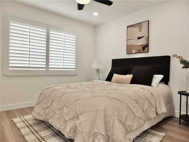 bedroom featuring recessed lighting, a ceiling fan, baseboards, and wood finished floors