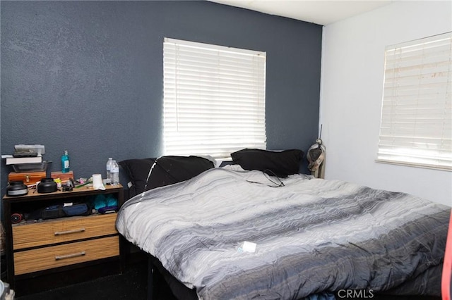 bedroom with multiple windows