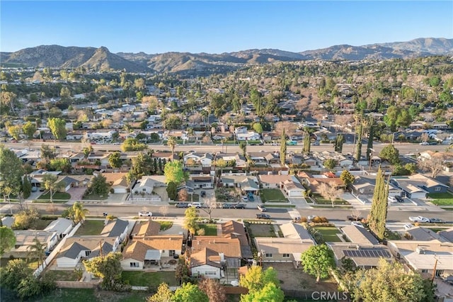 birds eye view of property featuring a mountain view and a residential view