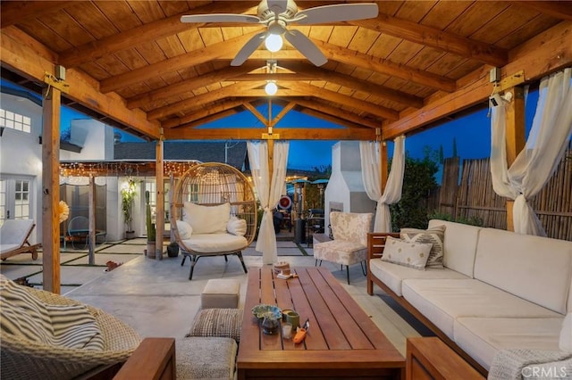 view of patio / terrace featuring a gazebo, ceiling fan, outdoor lounge area, and fence