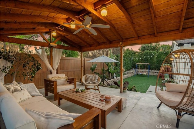 view of patio / terrace featuring a gazebo, a fenced backyard, and an outdoor hangout area