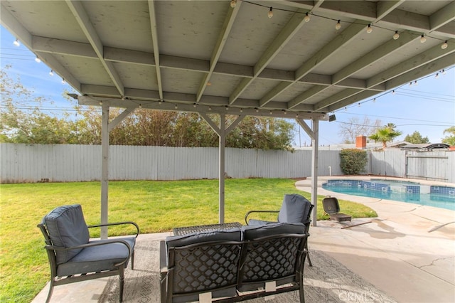 view of patio with a fenced backyard and a pool with connected hot tub