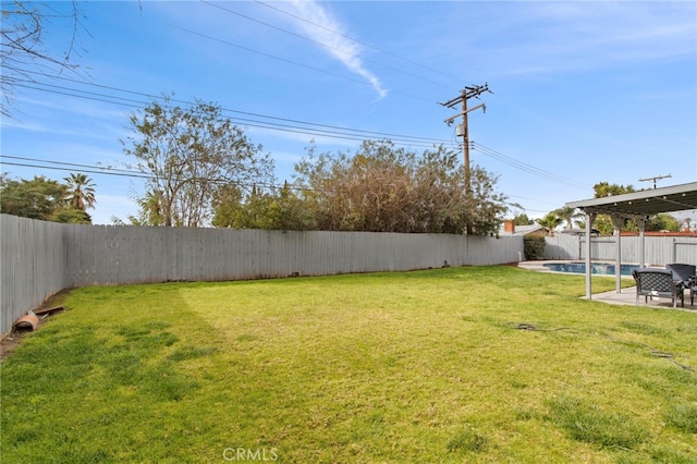 view of yard featuring a patio area and a fenced backyard