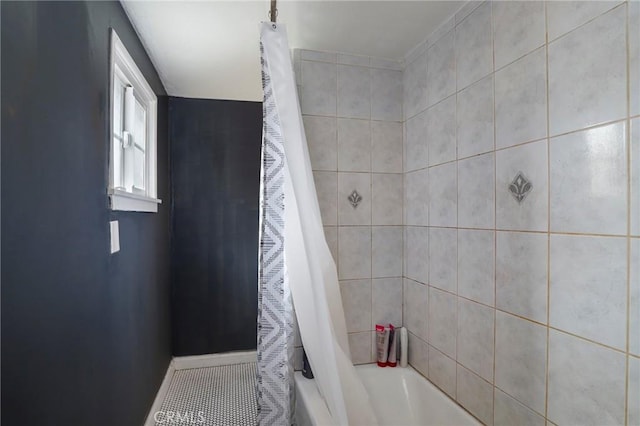 full bath featuring tile patterned floors and shower / bathtub combination with curtain