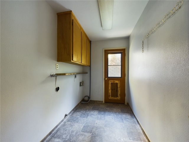 washroom featuring cabinet space