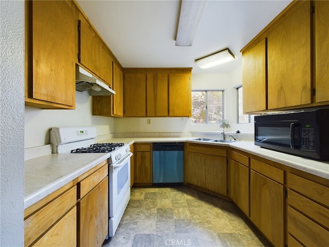 kitchen featuring white range with gas stovetop, a sink, under cabinet range hood, black microwave, and dishwasher