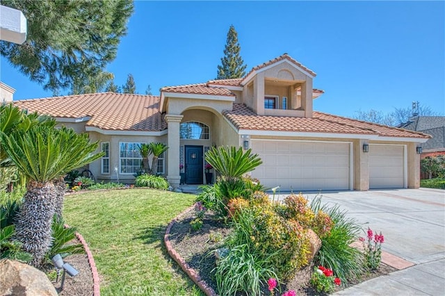 mediterranean / spanish-style home with stucco siding, concrete driveway, a front lawn, and a tile roof