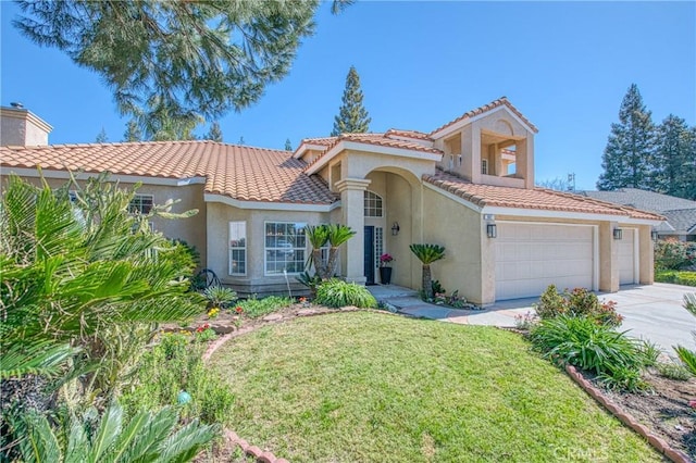 mediterranean / spanish house featuring a tile roof, a front lawn, driveway, and stucco siding