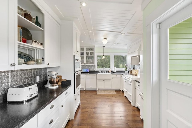 kitchen with a sink, dark wood-type flooring, white appliances, white cabinetry, and open shelves