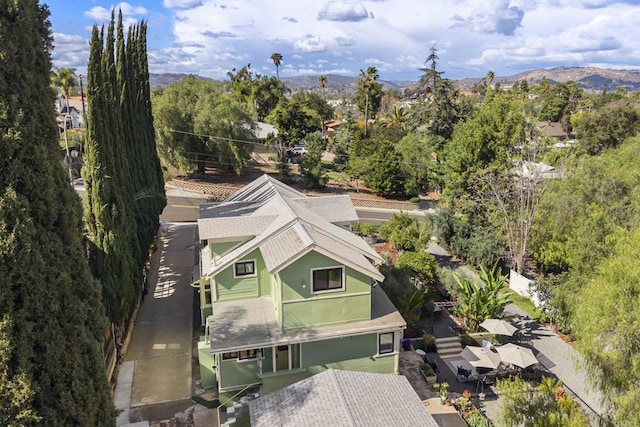 birds eye view of property with a mountain view