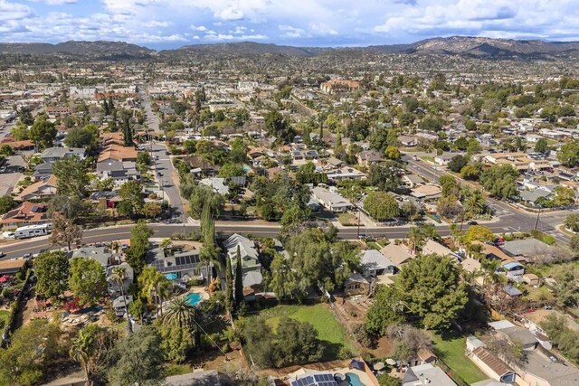 birds eye view of property with a residential view and a mountain view