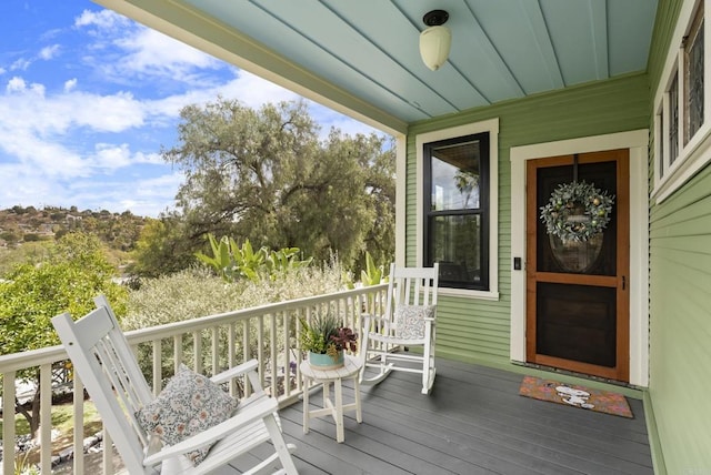 wooden terrace featuring a porch