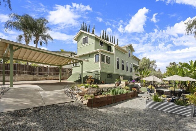 exterior space with a patio and fence